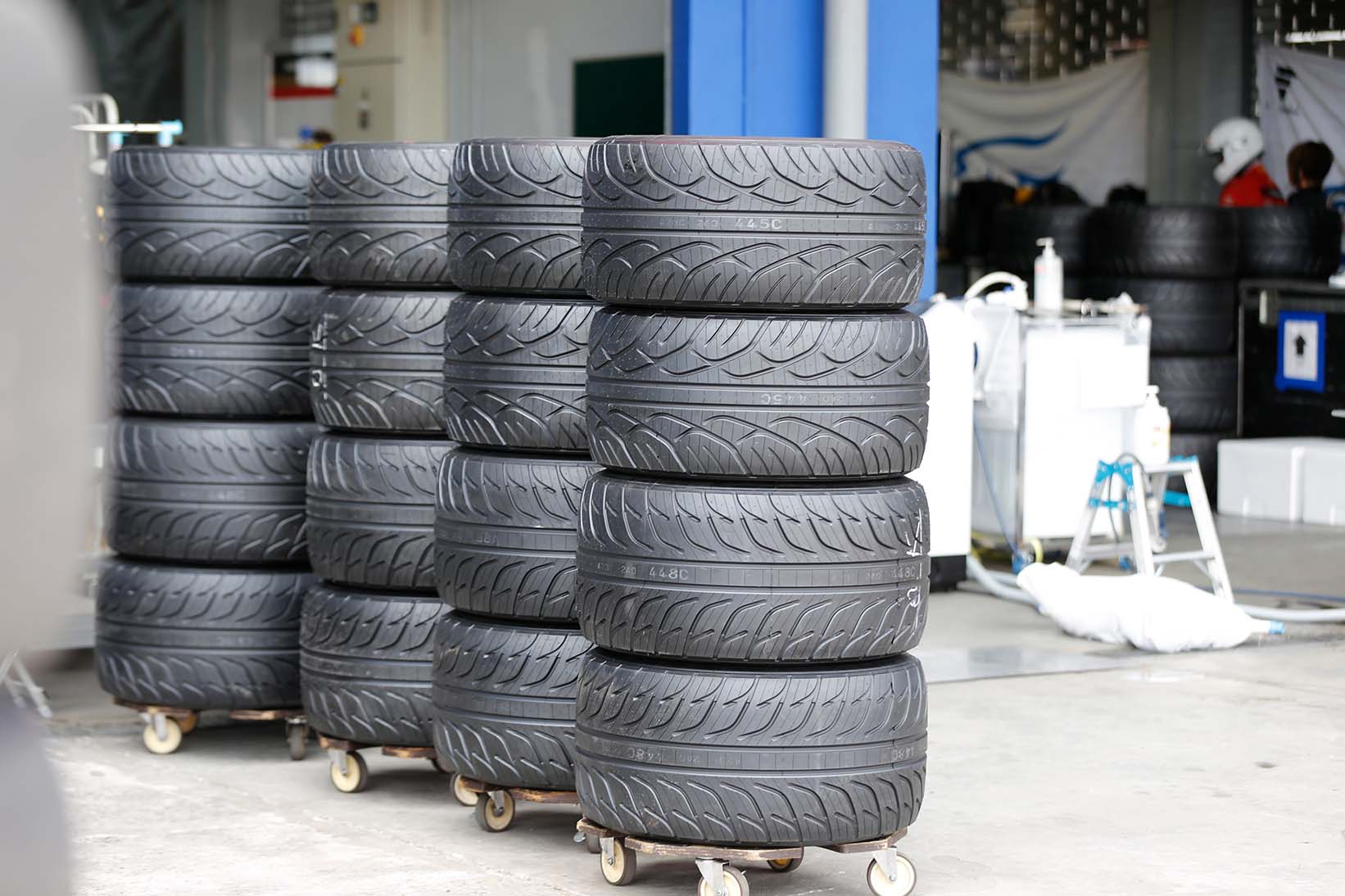 Stacked tires arranged in precise formation.